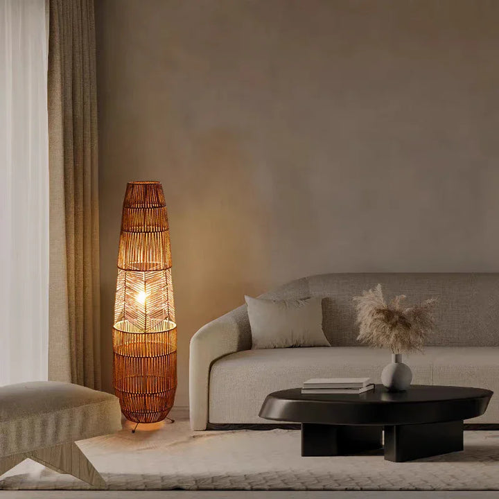 Modern living room with woven floor lamp, beige sofa, and round coffee table with decor